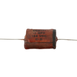 Reproduction 1954 phonebook-style capacitor. Brown wax with film condenser. 0.1 mfd, 150 VDC. 2 inch wire lead